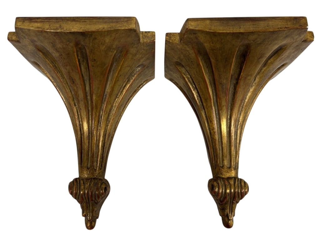 PAIR CARVED GILTWOOD WALL BRACKETS 13": Decorative pair of carved giltwood wall brackets featuring dramatic fluted, fan-form bodies rising to sculptural foliate and scroll-form finials. The rich antiqued gold finish displays warm red undert