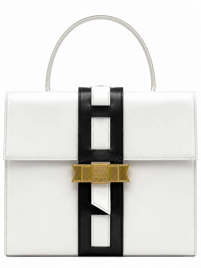 CELINE PARIS LEATHER RIBBON HANDBAG 12": This elegant Celine Paris handbag is crafted in smooth white leather with a striking black leather center strap and a distinctive gold-tone geometric clasp engraved with the Celine name. Made in Italy