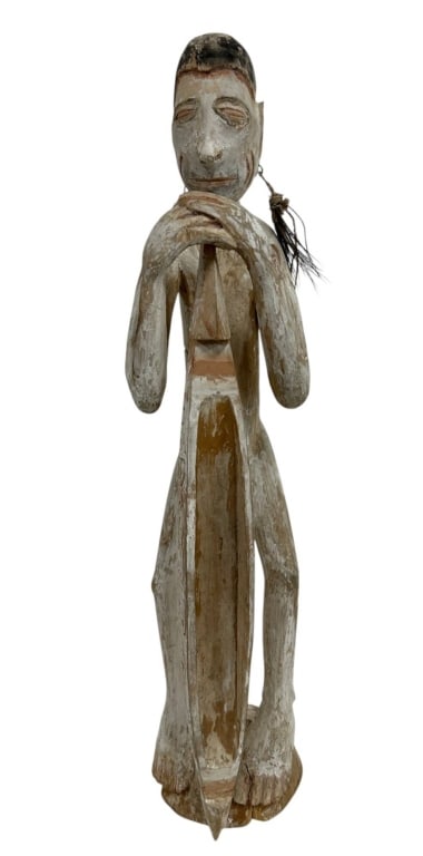 LARGE OCEANIC TRIBAL CARVED FIGURE 26": Striking hand-carved wooden tribal figure featuring an elongated standing form with dramatically extended arms and oversized hands crossed beneath the face. The stylized visage has a long nose, narrow