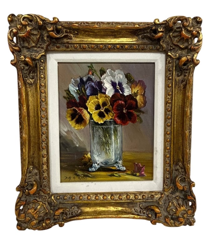 SIGNED PANSY FLORAL STILL LIFE PAINTING 16": Charming signed floral still life painting depicting a colorful bouquet of pansies arranged in a clear glass vase. The composition features rich yellow, burgundy, violet, white and blue blossoms rende