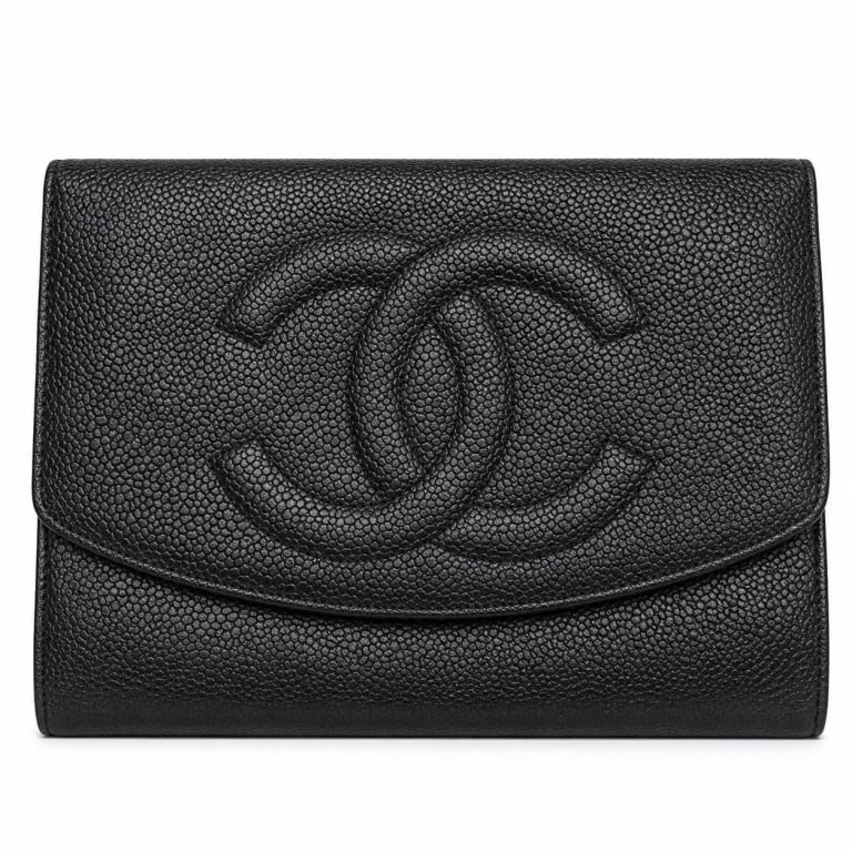 CHANEL CAVIAR CC BIFOLD WALLET 7.5": Vintage Chanel black caviar leather long bifold wallet featuring the house?s iconic oversized tonal interlocking CC logo stitched/embossed across the front flap. Crafted in richly textured black cavia