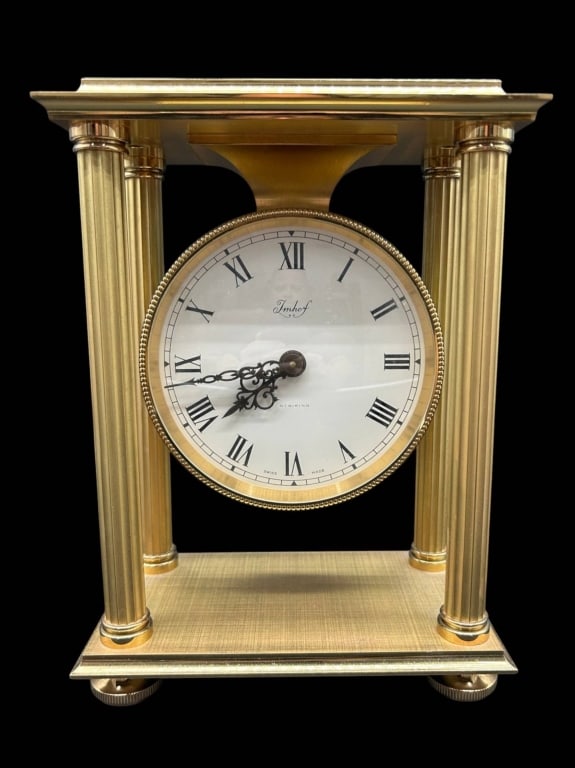 IMHOF SWISS GILT HEAVY BRASS STRIKING CLOCK 9": Fine Imhof Swiss gilt-brass architectural mantel/table clock featuring a neoclassical four-column case with fluted supports, stepped cornice and base, and suspended circular dial. The white dial is si