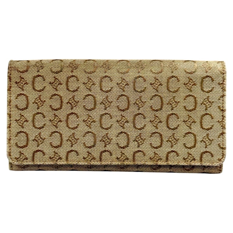 VINTAGE CELINE C MACADAM LONG WALLET 8": Vintage Celine long continental wallet featuring the house?s classic brown C Macadam monogram woven canvas with coordinating brown leather interior and trim. The exterior displays the repeating Celine