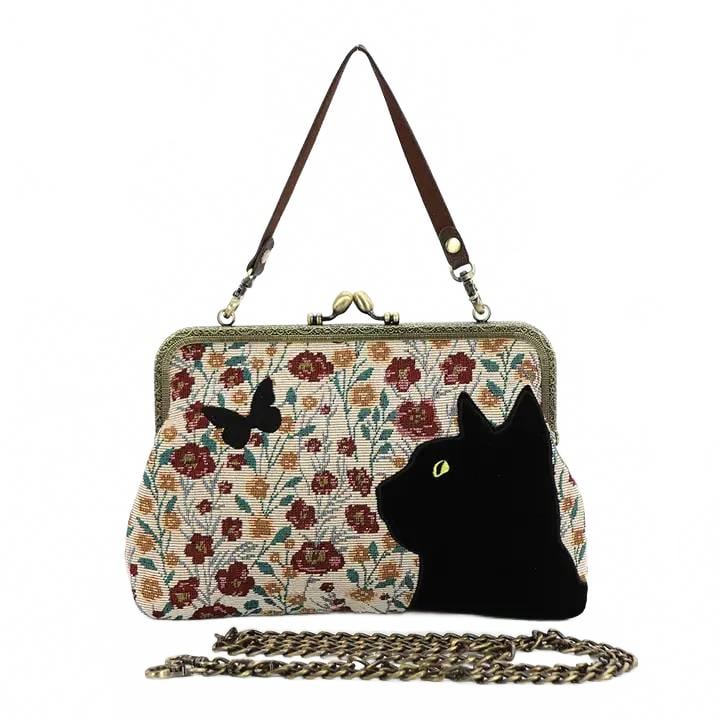 NEW FLORAL CAT KISSLOCK BAG: Add a touch of vintage whimsy to your accessory collection with the Floral Black Cat Kisslock Bag. Featuring an elegant embroidered floral design paired with a charming black cat and butterfly crafted