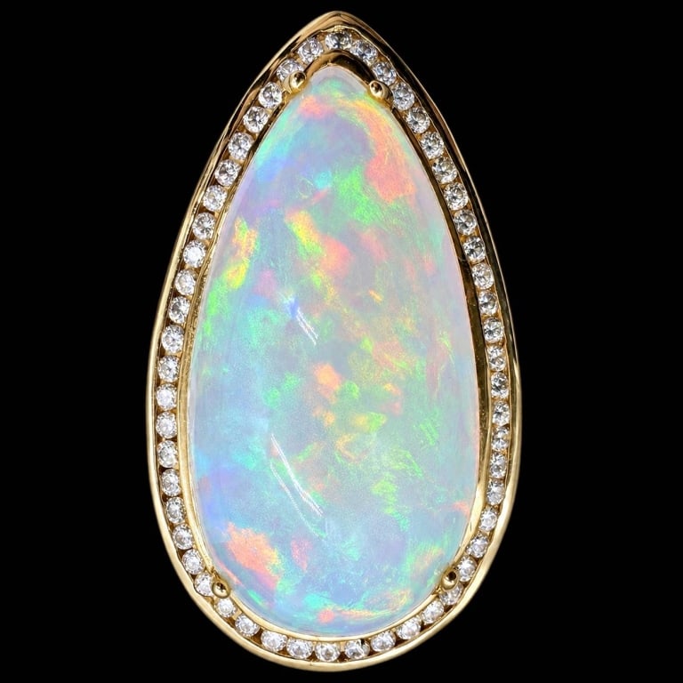 14K MONUMENTAL 17.49CT OPAL DIAMOND RING SZ 7: Impressive 14K yellow gold statement ring centered by an exceptionally large pear-shaped opal weighing approximately 17.49 carats, displaying beautiful play-of-color with flashes of green, yellow, ora