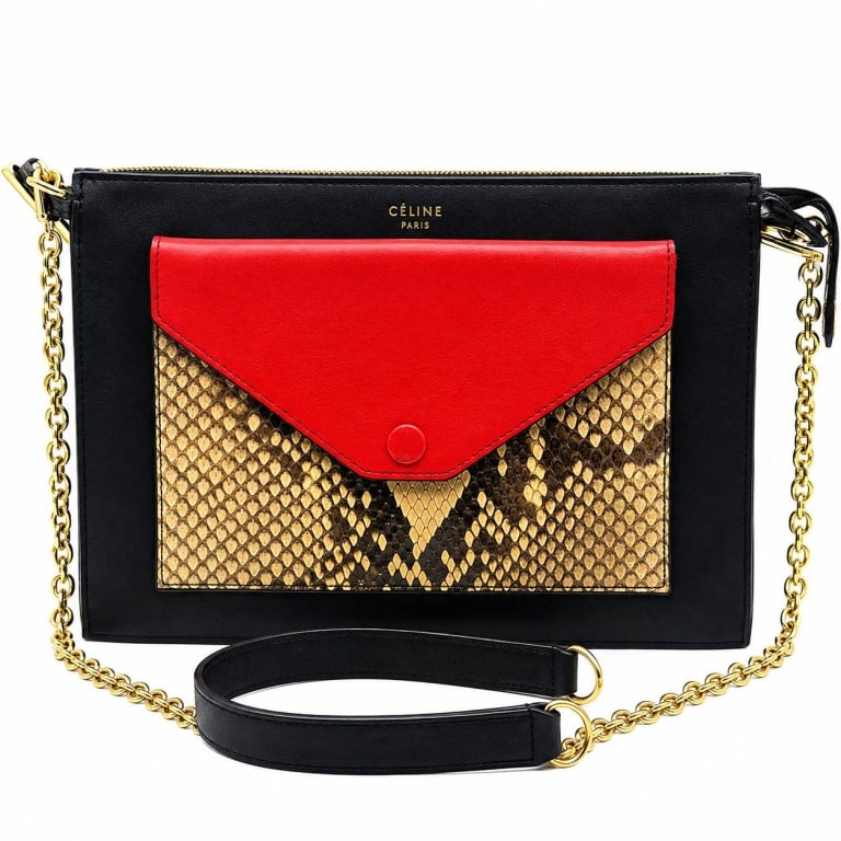 CELINE TRICOLOR PYTHON ENVELOPE CRSSBDY W COA 10": CELINE Tricolor Envelope Python Chain Pouch featuring a sleek black leather body accented by a striking genuine python front pocket and vivid red leather envelope-style flap. The bold combination of b