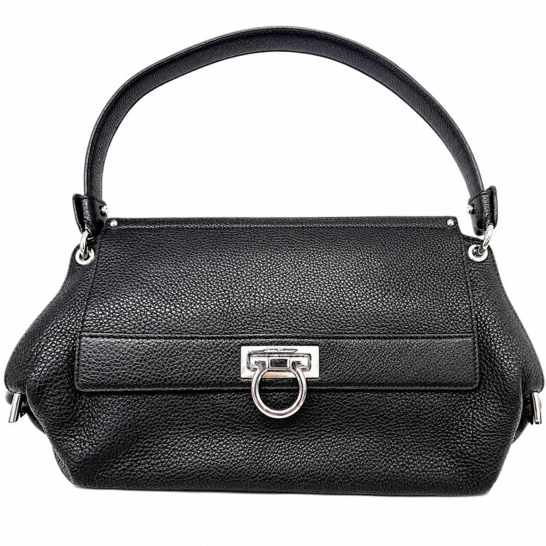 SALVATORE FERRAGAMO GANCINI SHOULDER BAG W COA 12": Vintage Salvatore Ferragamo Gancini Olivia shoulder bag crafted in supple black pebbled leather with a softly structured silhouette and signature silver-tone Gancini hardware. The front features the i