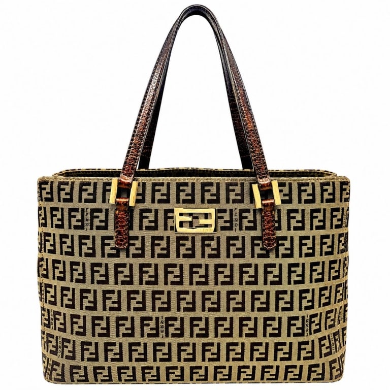 FENDI ZUCCHINO FF CANVAS TOTE 11": Vintage Fendi Zucchino FF tote crafted in signature beige and dark brown woven monogram canvas with repeating FF motif, dark brown leather shoulder straps and gold-tone hardware. Structured rectangula