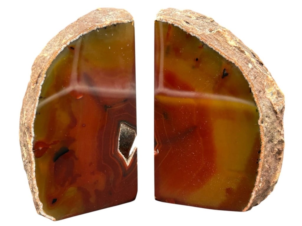 PAIR NATURAL AGATE GEODE BOOKENDS 6": Striking pair of natural agate geode bookends, cut from a single formation and polished on the interior faces while retaining the contrasting rough natural stone exterior. The polished faces display r