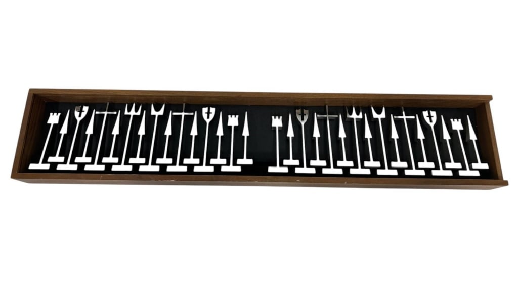 VINTAGE MODERNIST CHESS SET DISPLAY 31": Striking vintage modernist chess set presented in a long walnut-tone wood display/storage case with blue-tinted cover. The set includes stylized white and black chess pieces distinguished by dramatica