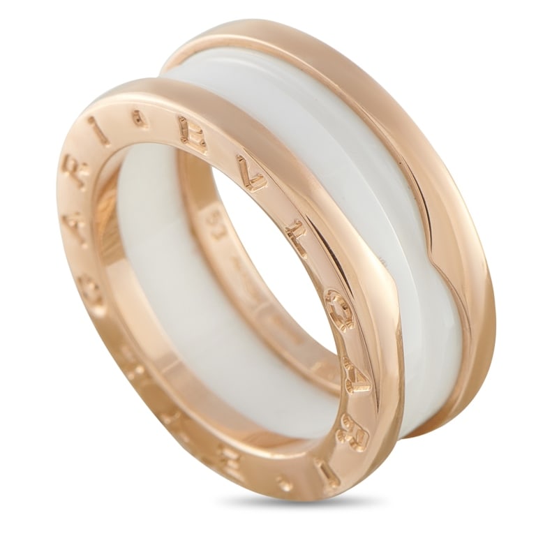 BVLGARI B.ZERO1 18K ROSE GOLD WHITE CERAMIC RING B: Add style and sophistication to any ensemble with this Bvlgari B.Zero1 ring. Inspired by the aesthetics of Roman architecture, this piece pairs lustrous 18K Rose Gold with a white ceramic accent at th