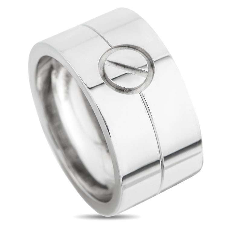 CARTIER LOVE 18K WHITE GOLD RING CA15-051926: This Cartier LOVE ring is stylish in its simplicity. The collections screw motif makes a statement at the center of the 18K White Gold band, providing this piece with an undeniable sense of luxury. It