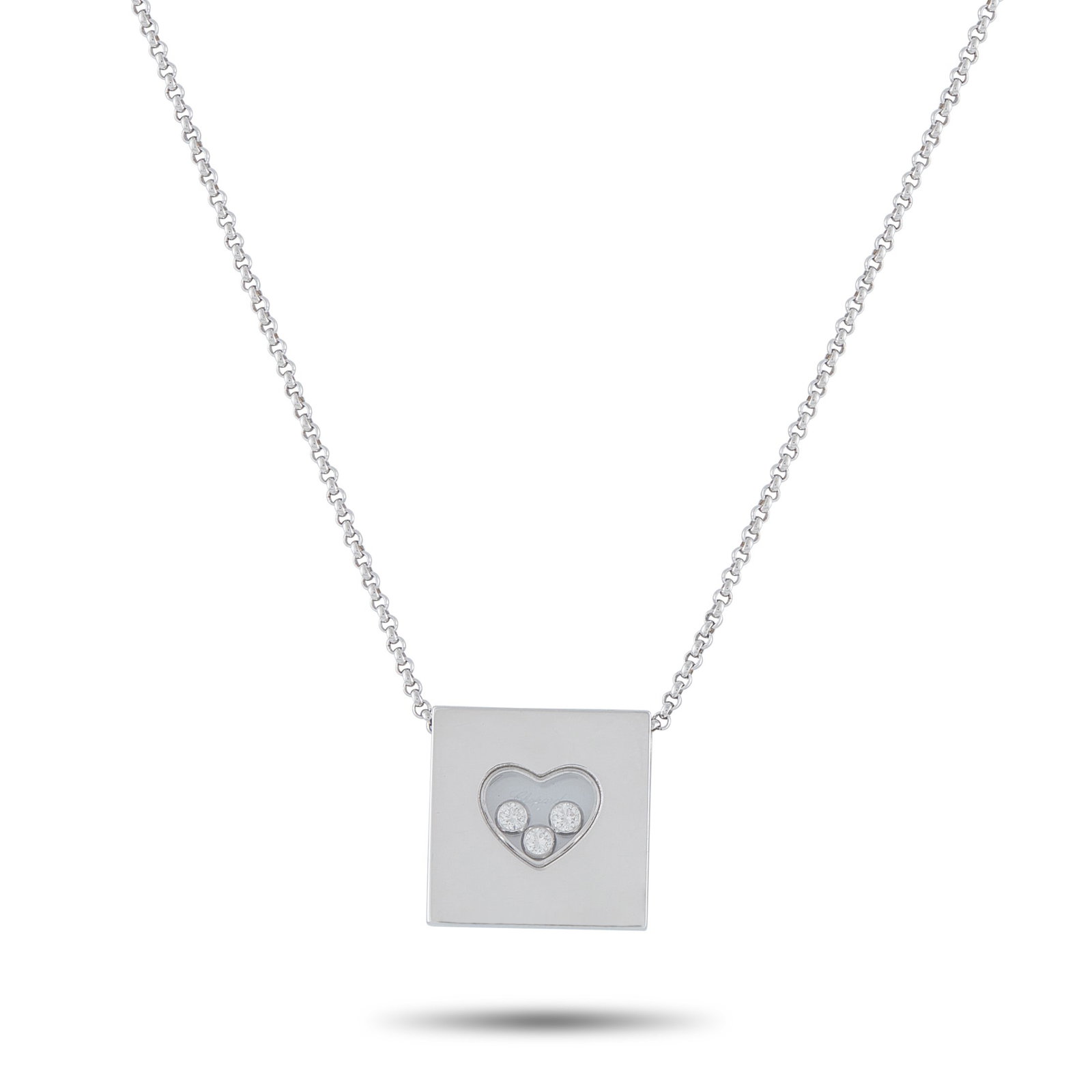 CHOPARD HAPPY DIAMONDS 18K GOLD NECKLACE: This Chopard Happy Diamonds necklace offers enduring elegance. The pendant includes a transparent heart-shaped center that contains a trio of floating Diamonds totaling 0.17 carats. Crafted from 18K W