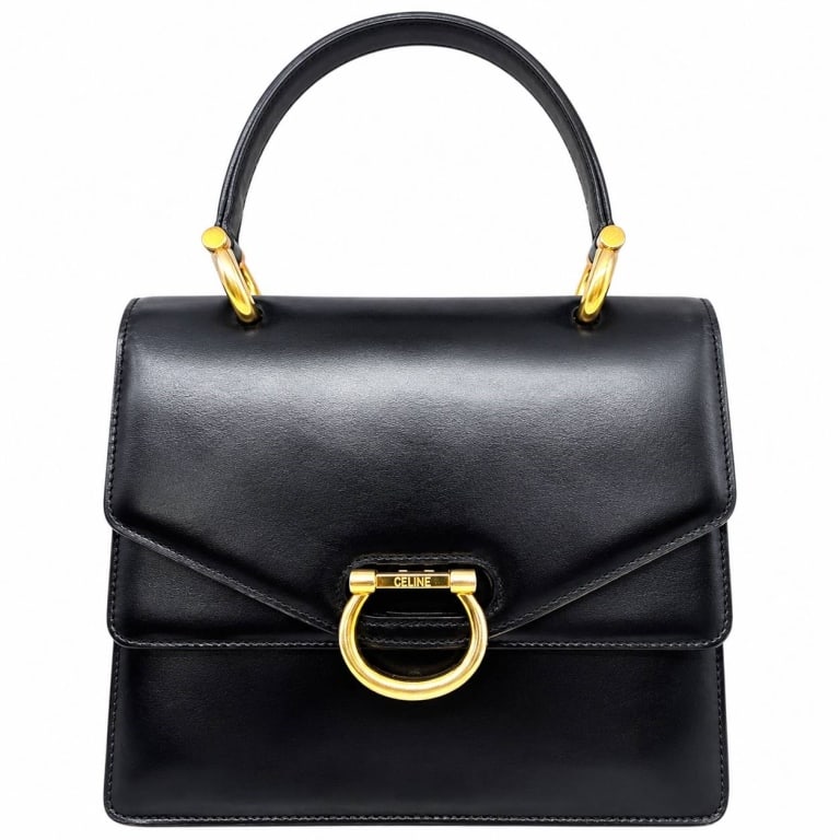 CELINE VINTAGE BLACK LEATHER TOP HANDLE BAG 8.5": Vintage CELINE Paris structured handbag crafted in smooth black leather with a sophisticated architectural silhouette. Features a sculpted envelope-style flap, single leather top handle, and substanti