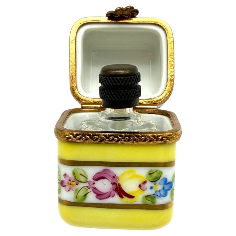 LIMOGES FRANCE PERFUME BOTTLE BOX 1.5": Charming miniature Limoges France hand-painted porcelain perfume bottle box featuring a vivid yellow ground with colorful floral decoration in pink, blue, yellow and green, accented with gilt bands an
