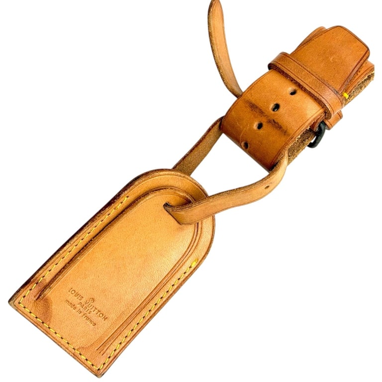 LOUIS VUITTON VACHETTA LEATHER LUGGAGE TAG 6": Louis Vuitton luggage and bag identification tag crafted in the house's signature natural Vachetta leather with yellow contrast stitching, raised border detailing and an adjustable leather buckle stra