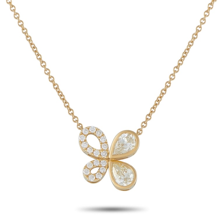 18K GOLD 1.70CT DIAMOND ASYMMETRICAL NECKLACE: Polished yet wearable, this necklace is made to be worn from morning through evening without effort. It is crafted in yellow gold and features a butterfly-inspired pendant defined by an asymmetrical f