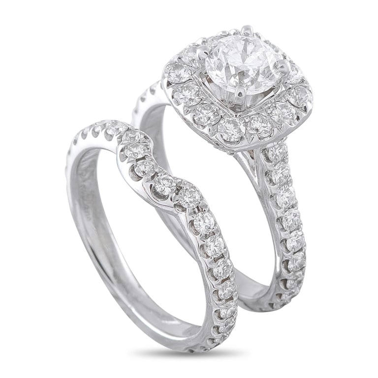 NEIL LANE 14K WHITE GOLD 1.50CT DIAMOND RING SET: This Neil Lane diamond engagement ring set is crafted in 14K white gold and includes two pieces: a cushion-halo engagement ring centered on a round brilliant-cut diamond weighing approximately 0.97 ca