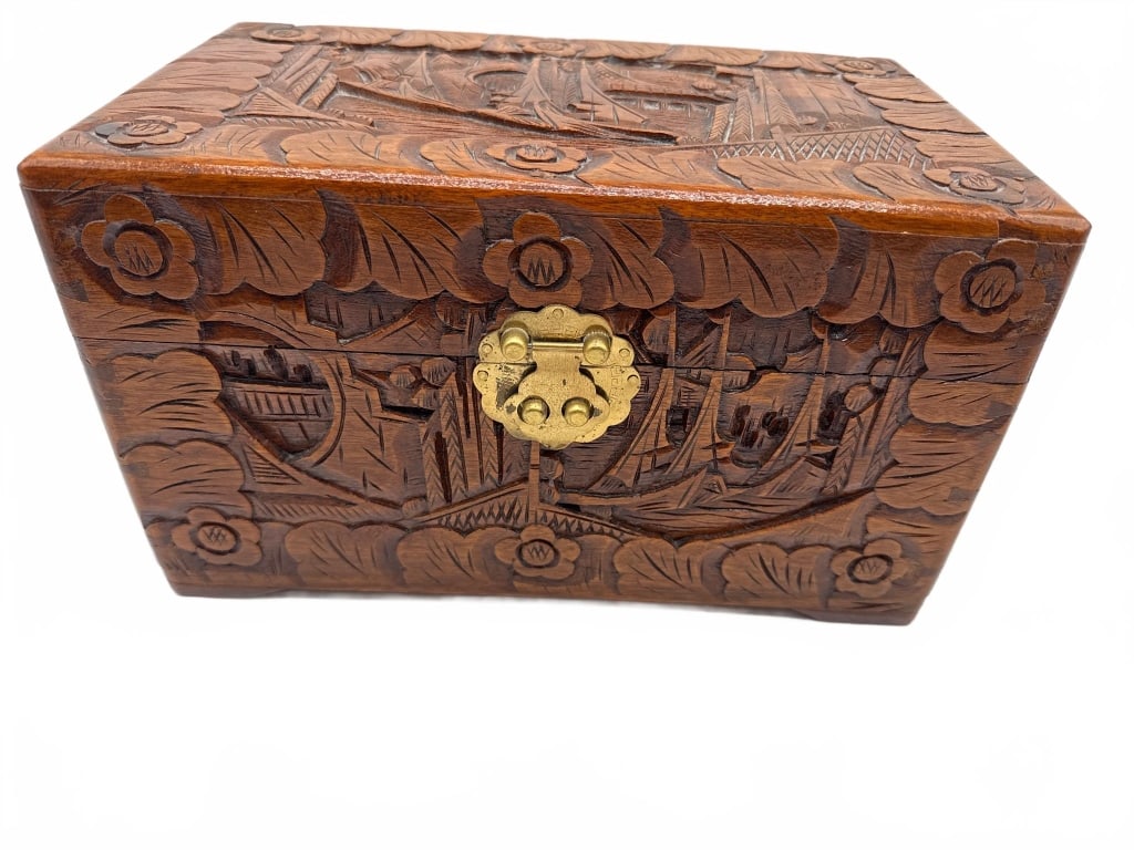 Vintage Hand-Carved Wooden Box with Key: This charming vintage wooden box features detailed hand-carved floral and ship motifs on the lid and sides. It includes a brass latch, green felt-lined interior, and comes with its original key. Measu
