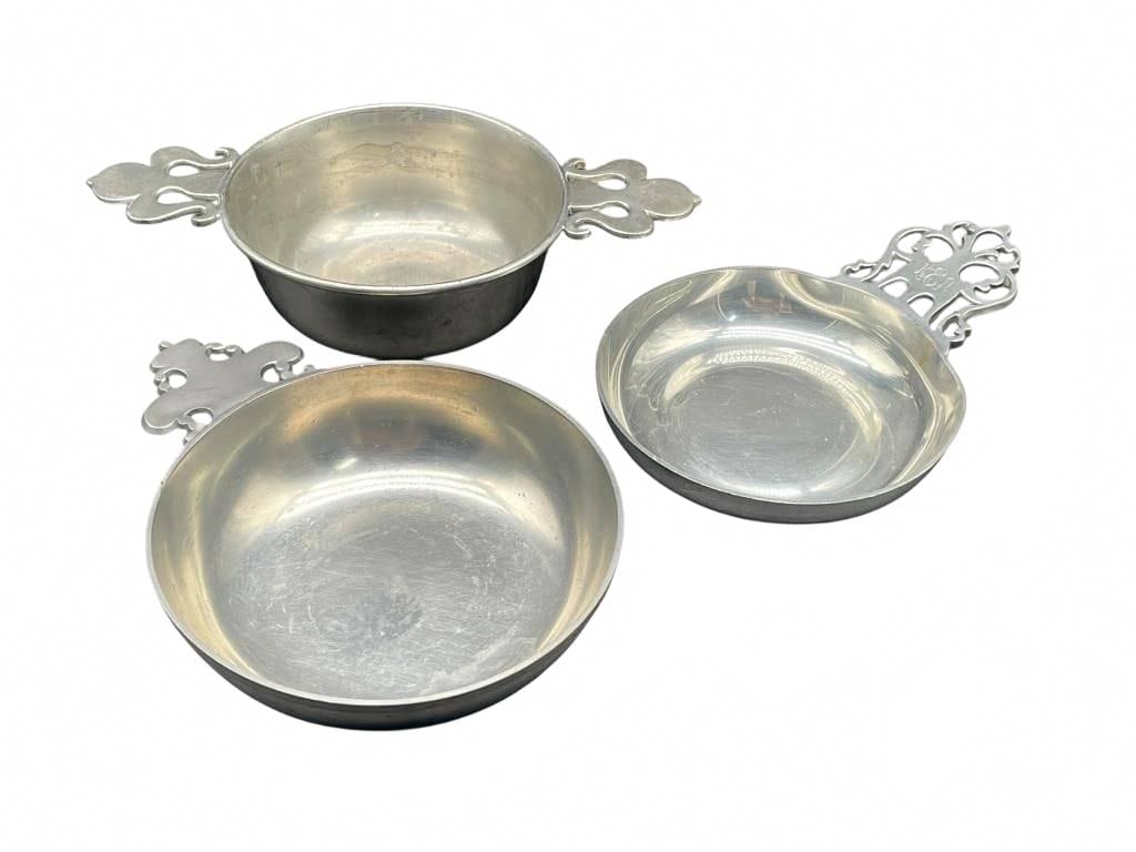 3 Vintage Pewter Bowls with Ornate Handles: This set consists of three vintage pewter bowls, each with an ornate pierced openwork handle featuring traditional scroll and foliate motifs. The bowls are in very good pre-owned condition and vary