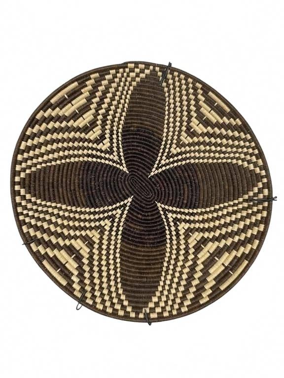 17" Geometric Star Pattern Basket Wall Plate: This basket wall plate measures approximately 17 inches in diameter and features an intricately designed geometric star pattern crafted from natural and dark-dyed fibers. Traditionally used for