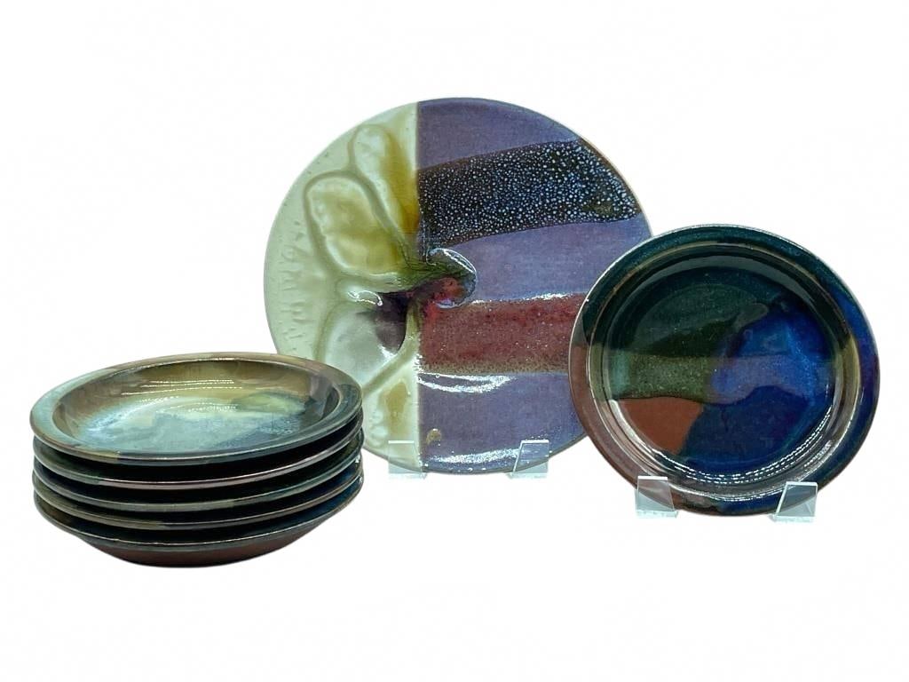 SET OF 7 SIGNED STUDIO ART POTTERY PLATES: SET OF 7 SIGNED STUDIO ART POTTERY PLATES | -VERY GOOD PRE OWNED CONDITION | -SIX 6" PLATES, ONE 9" PLATE | -STRIKING GROUP OF 7 STUDIO ART POTTERY PLATES FEATURING VARIEGATED MULTICOLOR GLAZES IN EAR