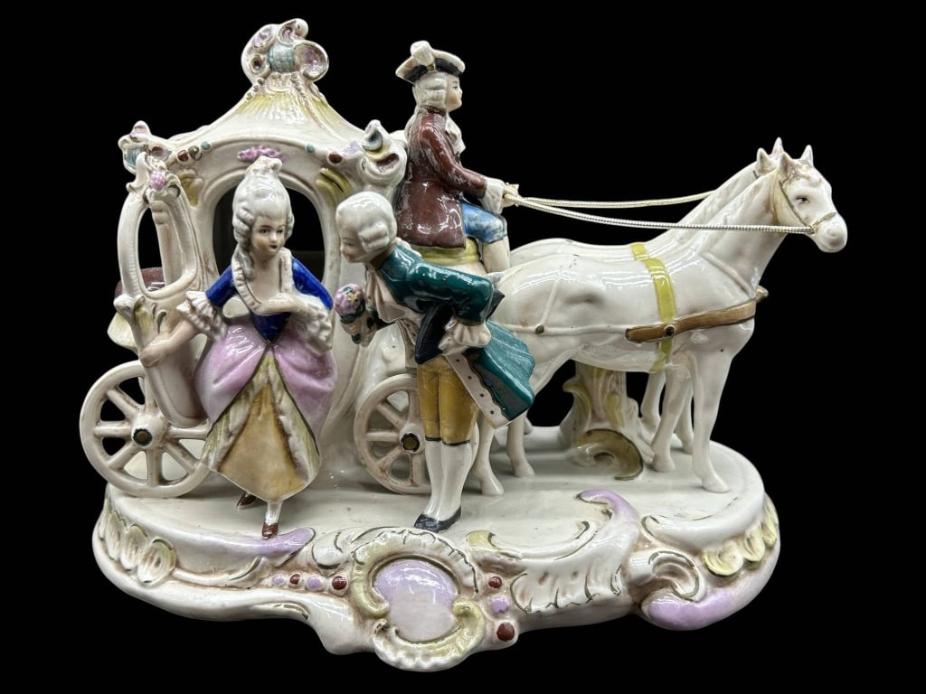 GERMAN PORCELAIN HORSE CARRIAGE FIGURE 10": Vintage German porcelain figural group depicting an elaborate 18th-century horse-drawn carriage scene with a gentleman presenting flowers to an elegantly dressed lady beside an ornate coach, coachman 