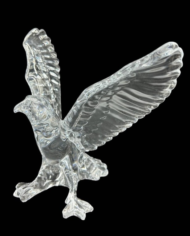 CLEAR CRYSTAL EAGLE SCULPTURE 7.5": Clear crystal sculpture depicting a majestic eagle with wings fully extended in an upward sweeping pose. The figure is modeled with detailed feathering along the wings, sculpted head and body, and pow