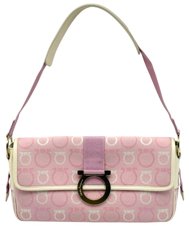 SALVATORE FERRAGAMO GANCINI PINK CANVAS HANDBAG: Salvatore Ferragamo shoulder handbag in pink and cream Gancini monogram canvas with leather trim and signature gold-tone Gancini hardware closure. Features a structured flap design, adjustable