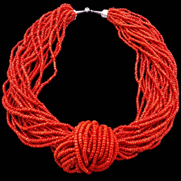 MULTI-STRAND RED CORAL BEAD NECKLACE 18": Dramatic vintage multi-strand necklace composed of numerous strands of tiny irregular red coral beads, gathered into a substantial sculptural design. The strands are artfully wrapped and knotted at