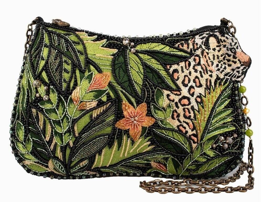 NEW MARY FRANCES SPOT ON BEADED CROSSBODY BAG: Go wild with this jungle inspired purse featuring lush green leaves, vibrant florals, and a striking leopard peeking through the foliage. Detailed beadwork brings the scene to life, while the chain