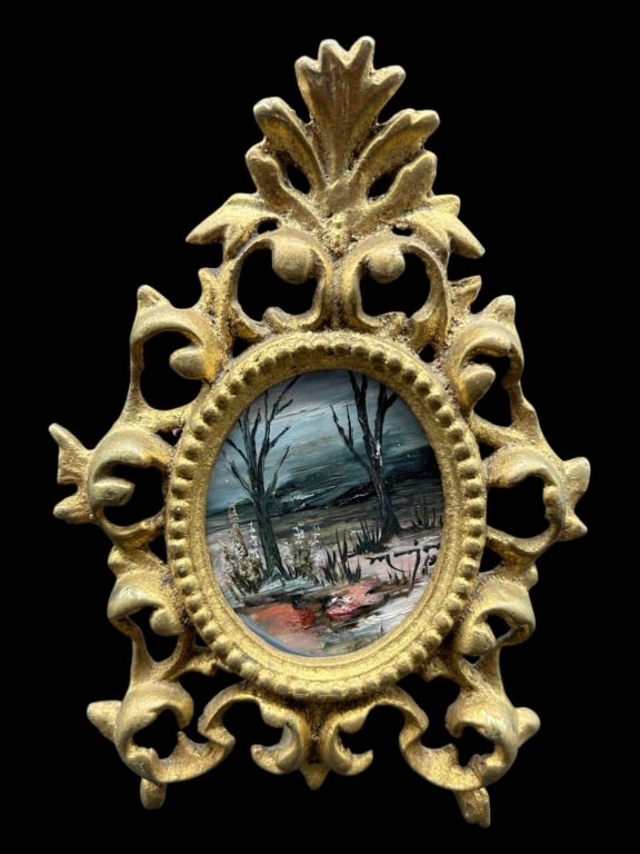 ANTIQUE GILT METAL MINIATURE LANDSCAPE 7": Charming antique miniature landscape painting presented in an elaborate gilt metal tabletop frame. The small oval composition depicts a wintry woodland landscape with bare trees, distant hills, snow-c