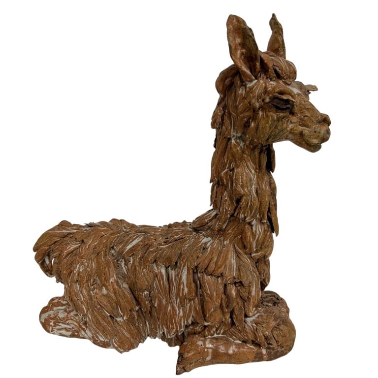 LARGE STUDIO POTTERY LLAMA SCULPTURE 17": Large hand-built studio pottery sculpture depicting a recumbent llama or alpaca, modeled with an expressive elongated neck, upright ears and highly dimensional shaggy coat. Constructed from numerous i