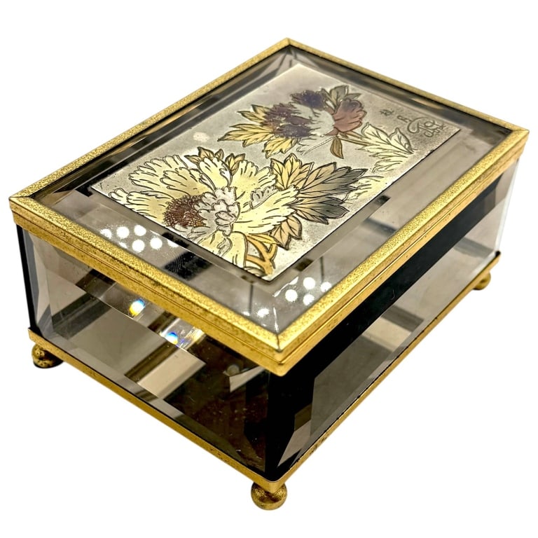 JAPANESE CHOKIN ART BEVELED GLASS BOX 5": Striking Japanese Chokin Art Gallery jewelry or trinket box by Precious Art Inc., constructed with thick beveled glass panels framed in gold-tone metal and raised on four ball feet. The hinged lid cen