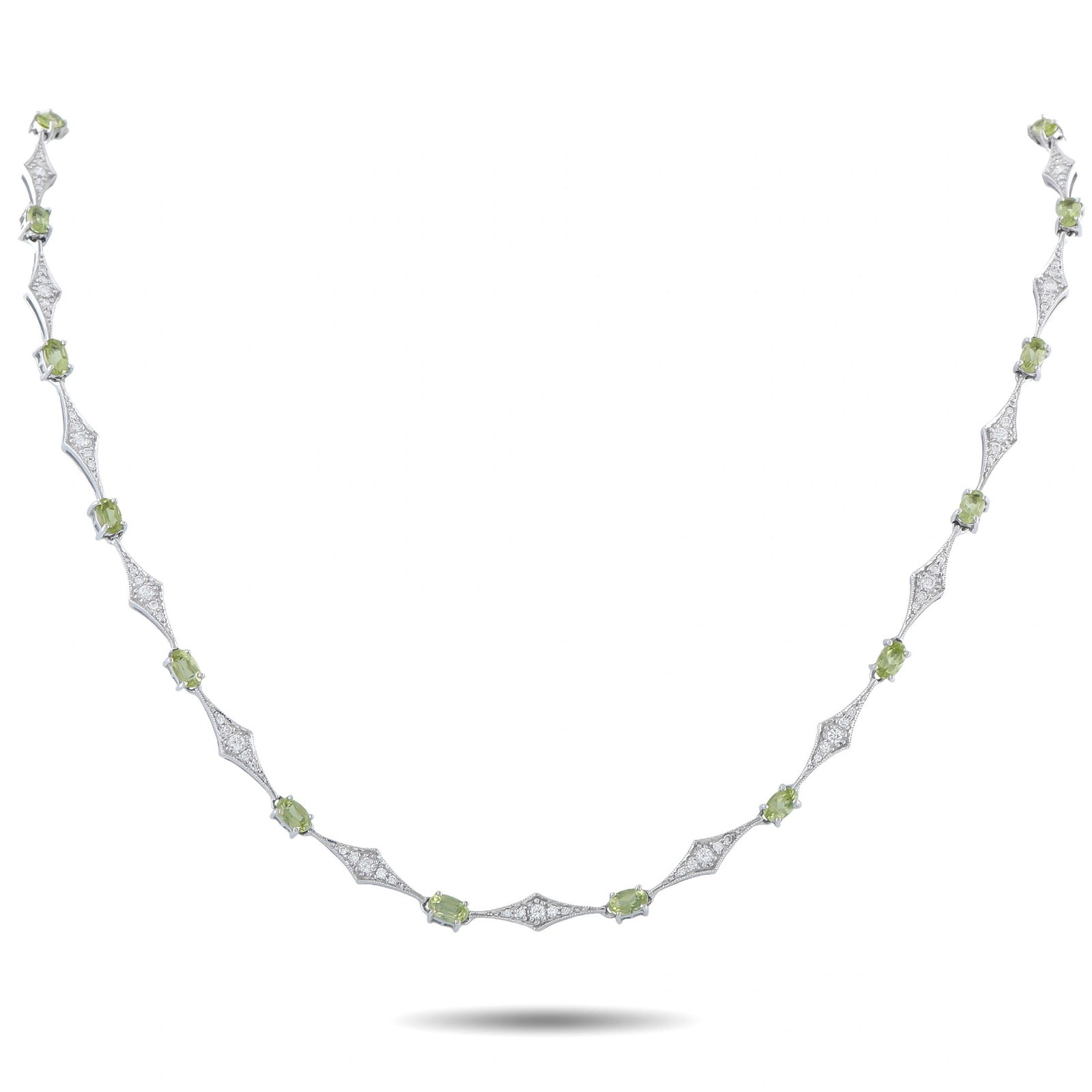 LAURA MUNDER 18K GOLD DIAMOND AND PERIDOT NECKLACE: A contemporary station necklace in 18K white gold by Laura Munder, set with vivid oval-cut peridots and round brilliant diamonds totaling approximately 1.20 carats. The design alternates prong-set ova