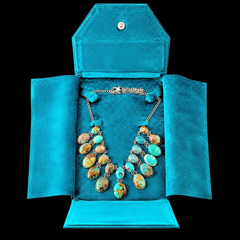 ROYSTON TURQUOISE & STRLNG 22 STONE NECKLACE 18": Striking and substantial Southwestern sterling silver statement necklace set with 22 graduated individual oval turquoise cabochons displaying vivid blue, aqua and green coloration with dramatic golden