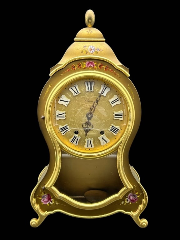 ELUXA SWISS MUSICAL BRACKET CLOCK 15": Vintage Swiss Eluxa gilt mantel or bracket clock with elegant shaped case and hand-painted floral decoration. The gilt dial features ornate engraved scrolling foliage, applied white enamel-style Roman