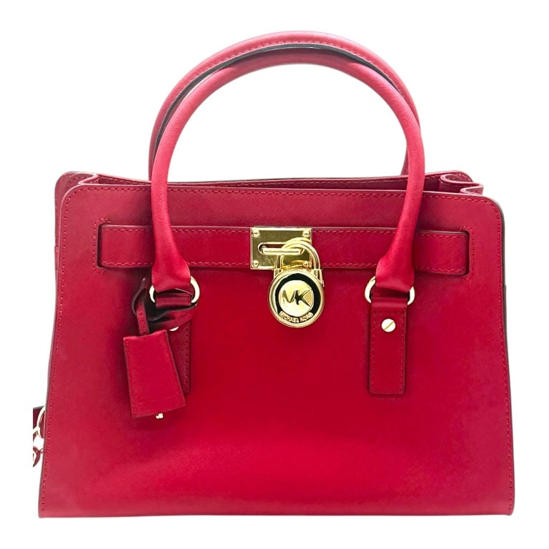 MICHAEL KORS HAMILTON RED SAFFIANO SATCHEL 11.5": Classic MICHAEL Michael Kors Hamilton satchel crafted in rich red crosshatch Saffiano leather with polished gold-tone hardware. This iconic structured design features the signature belted front with o