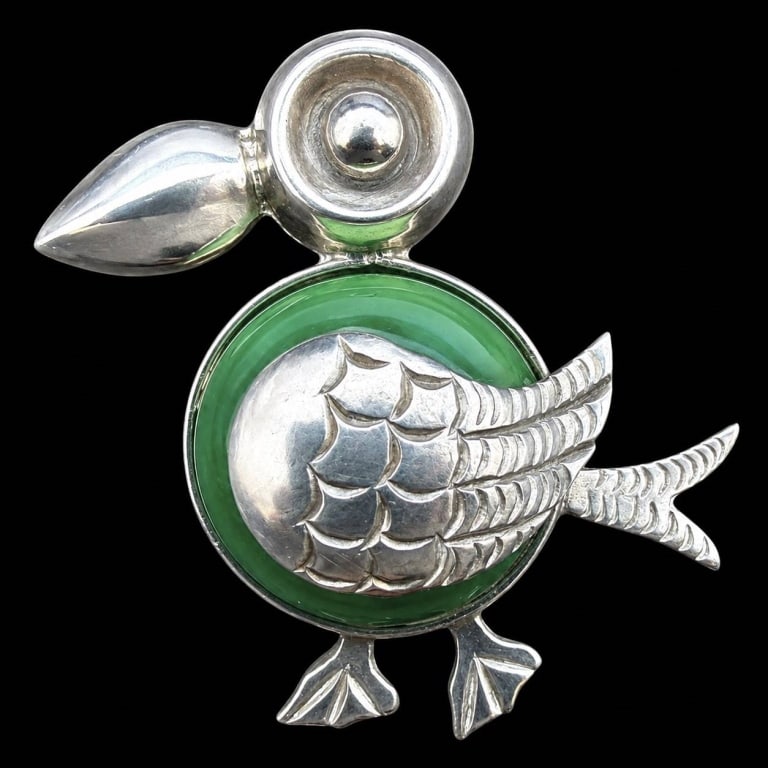 J.P. MEXICO STERLING & ONYX TOUCAN PIN 1.5": Charming vintage Mexican sterling silver toucan brooch featuring a whimsical mid-century figural design with an oversized curved beak, circular eye, engraved layered wing, forked tail and tiny feet. T