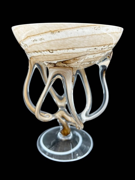 ART GLASS PEDESTAL COMPOTE SCULPTURE 7": Striking hand-blown art glass pedestal compote featuring a broad shallow bowl in creamy ivory and caramel tones with swirling striations and bubble-like inclusions. The bowl is supported by an elabora