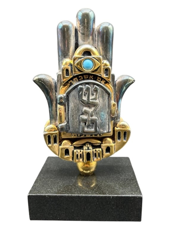 ARAD AVRAHAM STUDIO KEDEM JUDAICA HAMSA 8": Israeli Judaica sculpture by artist Arad Avraham for Studio Kedem, Jaffa, Israel. Handcrafted Hamsa-form composition in silver- and gold-plated metal, centered by a hinged mezuzah-style door with