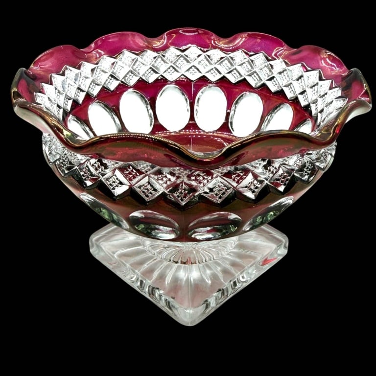 VINTAGE CRANBERRY CUT CRYSTAL COMPOTE 5": Decorative vintage cranberry and clear glass pedestal compote featuring a richly colored bowl with a dramatic scalloped rim, repeating geometric diamond cuts and large oval thumbprint-style motifs. Th