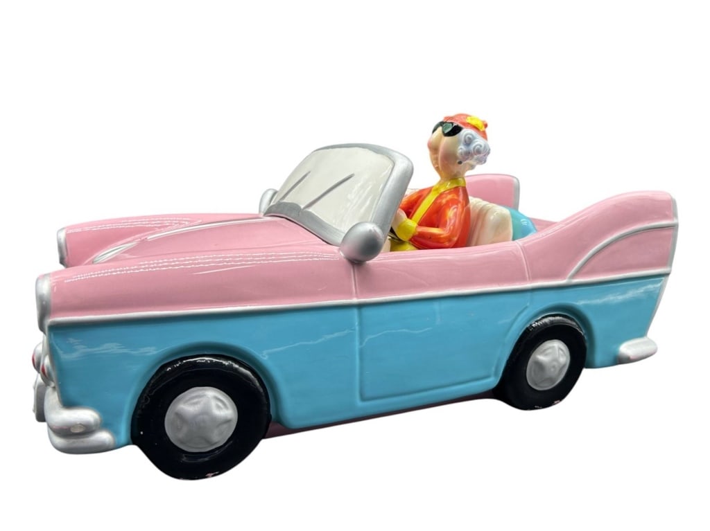 SHOEBOX GRANDMA PINK CONVERTIBLE FIGURINE 15": Whimsical Shoebox ceramic figural convertible featuring a colorful elderly lady driver seated in a retro-style pink and turquoise automobile. The hand-painted design features glossy pastel pink and bl