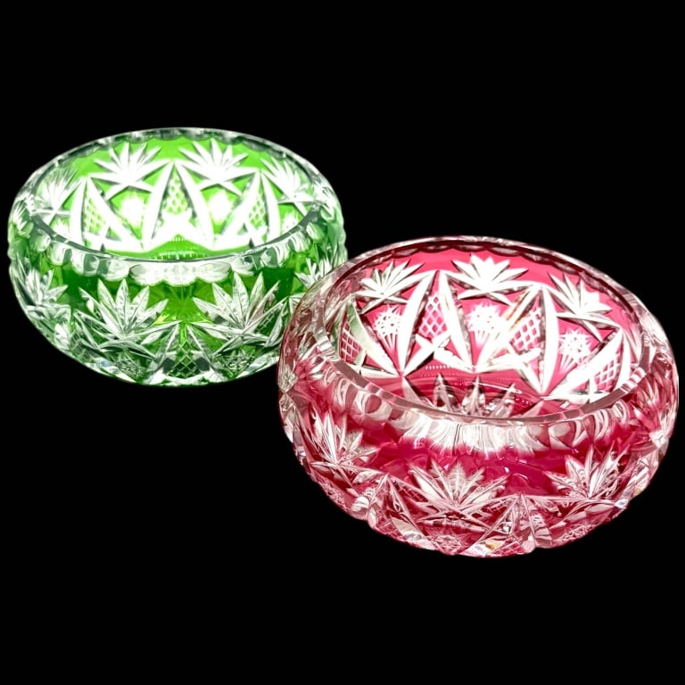 BOHEMIAN CUT TO CLEAR CRYSTAL BOWLS PAIR 5": Striking matched pair of vintage Bohemian-style cut-to-clear crystal bowls in vibrant emerald green and cranberry ruby pink. Each heavy crystal bowl is richly decorated with deeply cut starbursts, fan