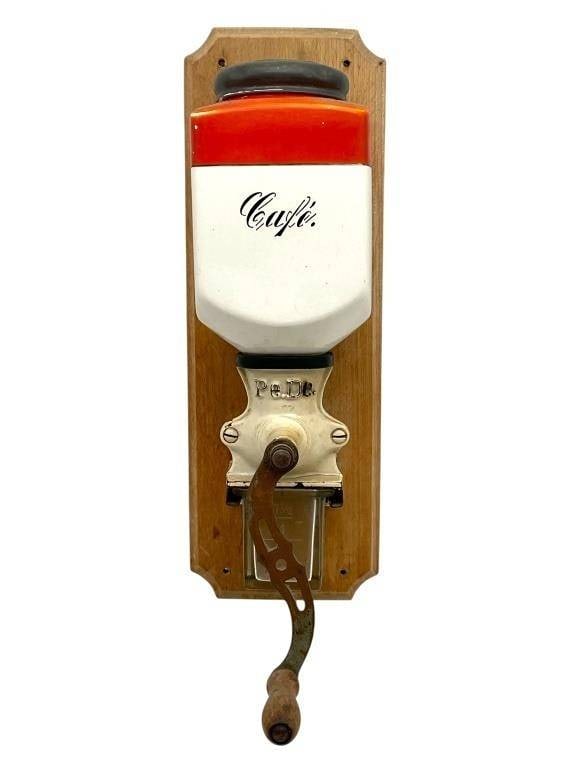 VINTAGE FRENCH WALL-MOUNTED CERAMIC COFFEE GRINDER: VINTAGE FRENCH WALL-MOUNTED CERAMIC COFFEE GRINDER | -VERY GOOD PRE OWNED CONDITION | -APPROX 14" X 4.5" X 8" | -FEATURES A WHITE AND ORANGE CERAMIC HOPPER MARKED ?CAFE? IN SCRIPT, METAL GRINDING MECH