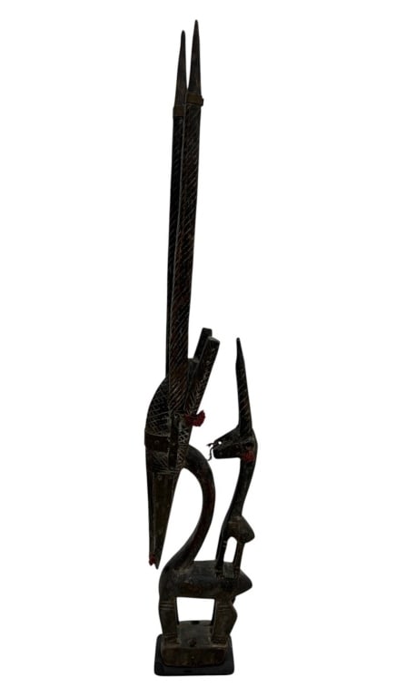 AFRICAN SENUFO STYLE CARVED WOOD FIGURE 29": Tall carved wood sculptural figure in an elongated African tribal style, depicting two highly stylized antelope-like animals arranged vertically with dramatically extended horns. Hand carved from dark