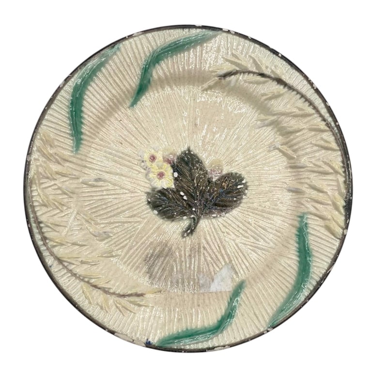 MAJOLICA WHITE FLOWER BOTANICAL PLATE 8": Decorative majolica-style ceramic plate modeled as a large open white flower with deeply textured radiating petals and raised botanical details. The cream-white glazed ground is accented with a dark d