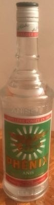 Phenix Anisette 1L Bottle, France: Phenix Anisette is a French distilled spirit with 45% alcohol content, infused with anise extract and other plant substances. This 1 liter bottle is produced in France and labeled as anise-flavored.