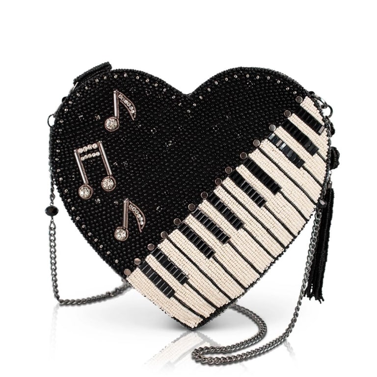 NEW MARY FRANCES HEARTWORKS BAG: Every Mary Frances piece is handmade! | Hit all the right notes with this music-loving crossbody purse! Heart-shaped and decked out in dazzling beads, it features a chic piano keyboard and floating mu