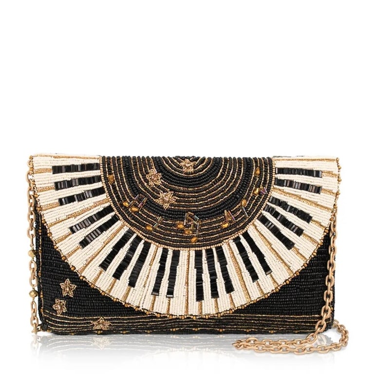 NEW MARY FRANCES LET IT PLAY BAG: From the first note to the final encore, Let It Play celebrates the magic of music. Flowing piano keys, golden notes, and sparkling stars bring this eye-catching purse to life. Whether you're a musici